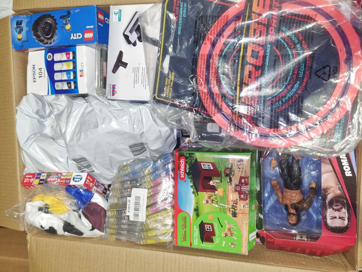 Open StockBee box with a LEGO City set, Epson ink, Schleich Farm World set and a flying disc